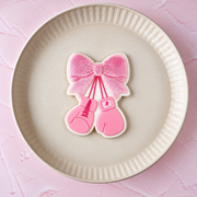 Schleife mit Boxhandschuhen