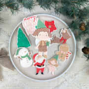 Wichteljunge mit Geschenk